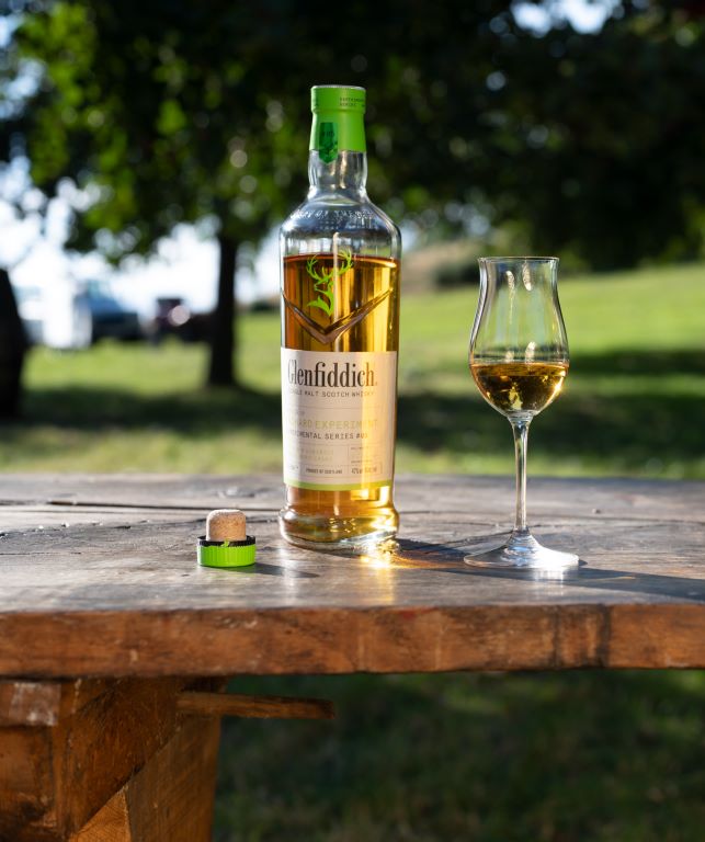 Glenfiddich Orchard Experiment Whisky Bottle displayed on a table with a tasting glass
