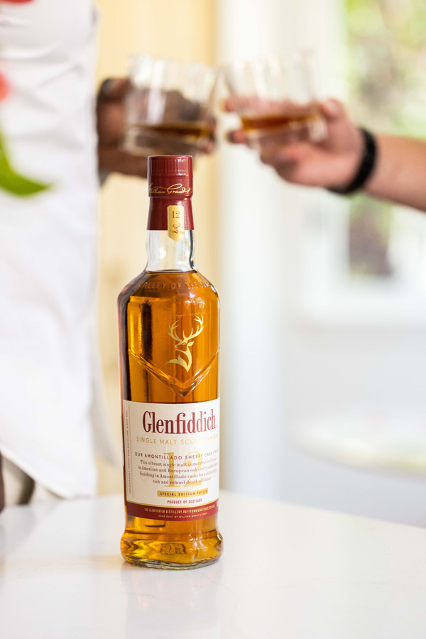 Glenfiddich sherry cask bottle with drinkers in background