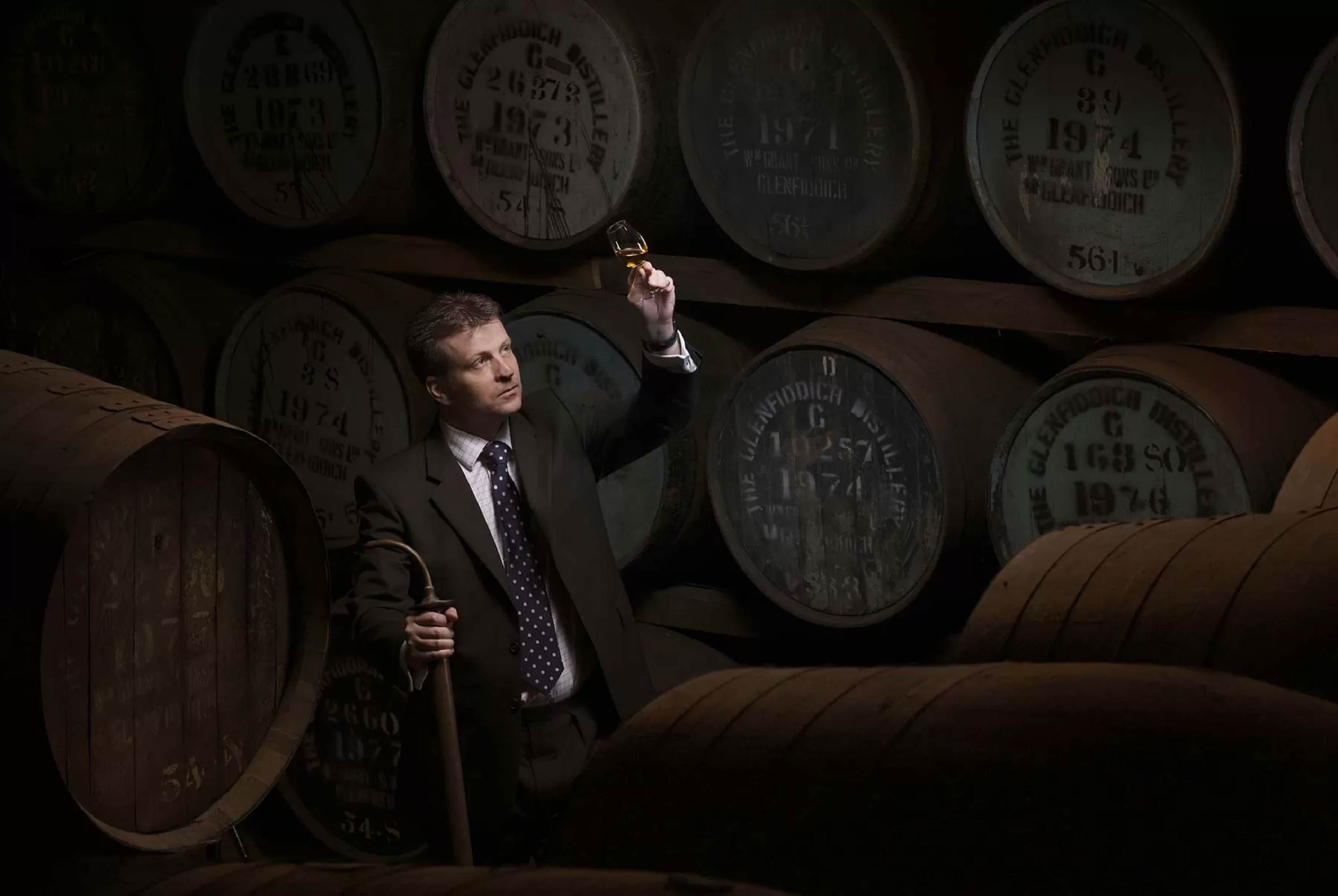 Brian Kinsman in a whisky warehouse