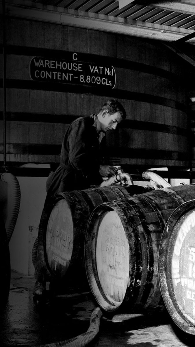 Black and white picture of workers in distillery