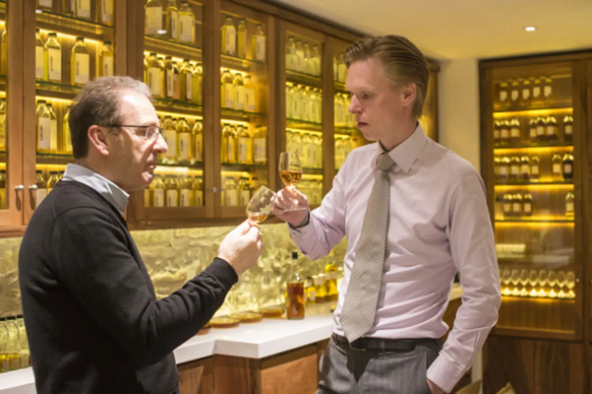 Two men tasting whisky