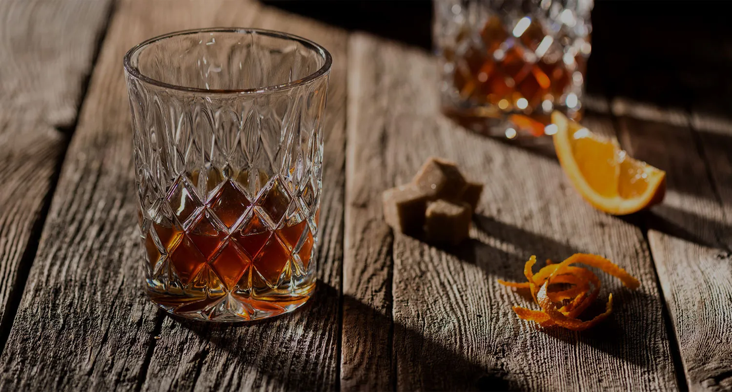 Whisky cocktail on a wooden table