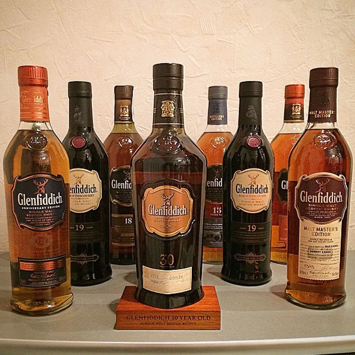 Eight bottles of Glenfiddich on a table